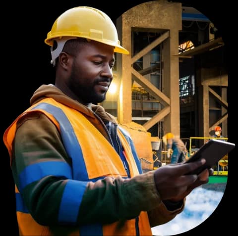 Worker inspecting tablet in an industrial facility